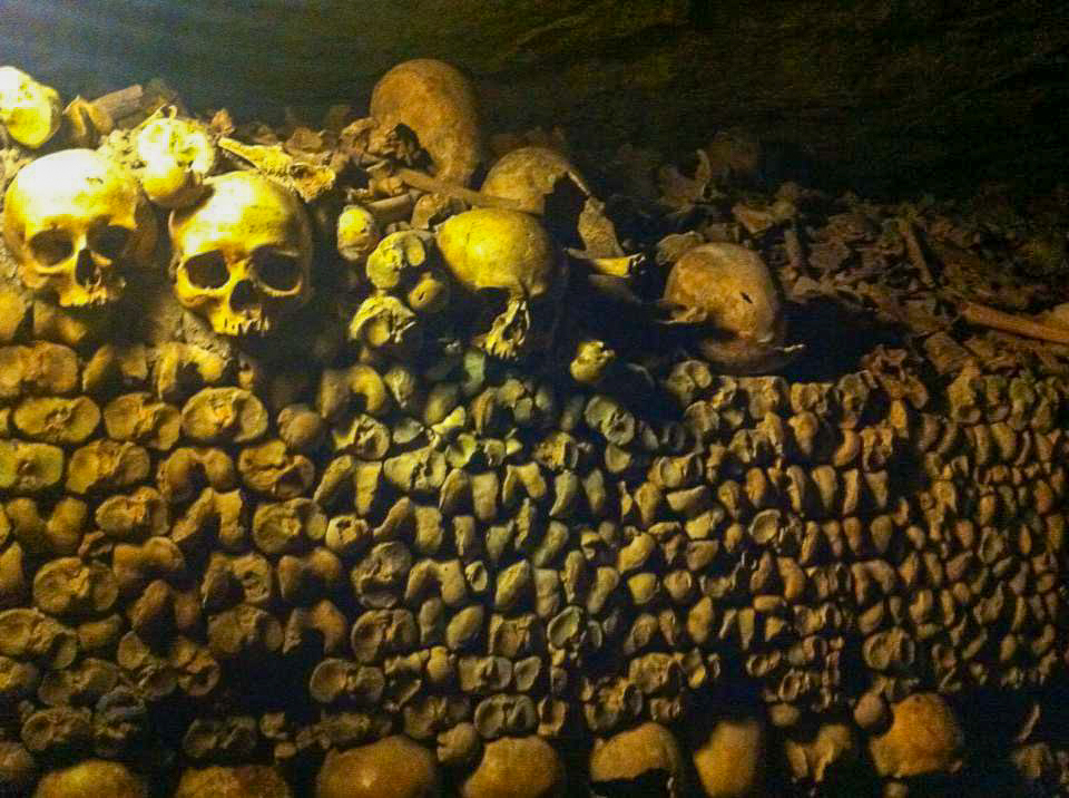 Catacombs in paris, stacked rows of bones and sculls