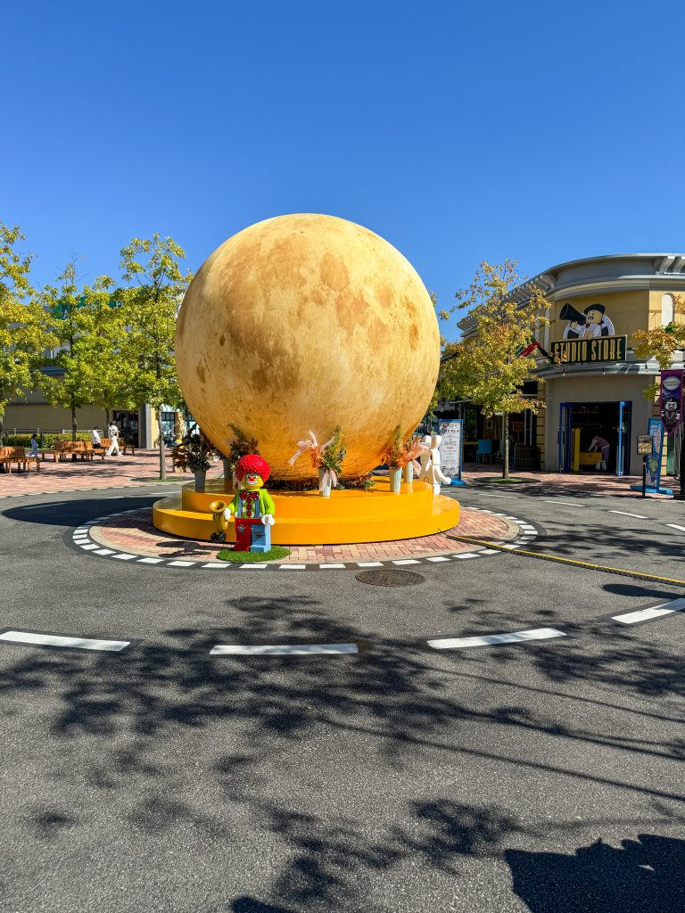Oversized moon roundabout in the middle of a crossroads at Legoland Korea