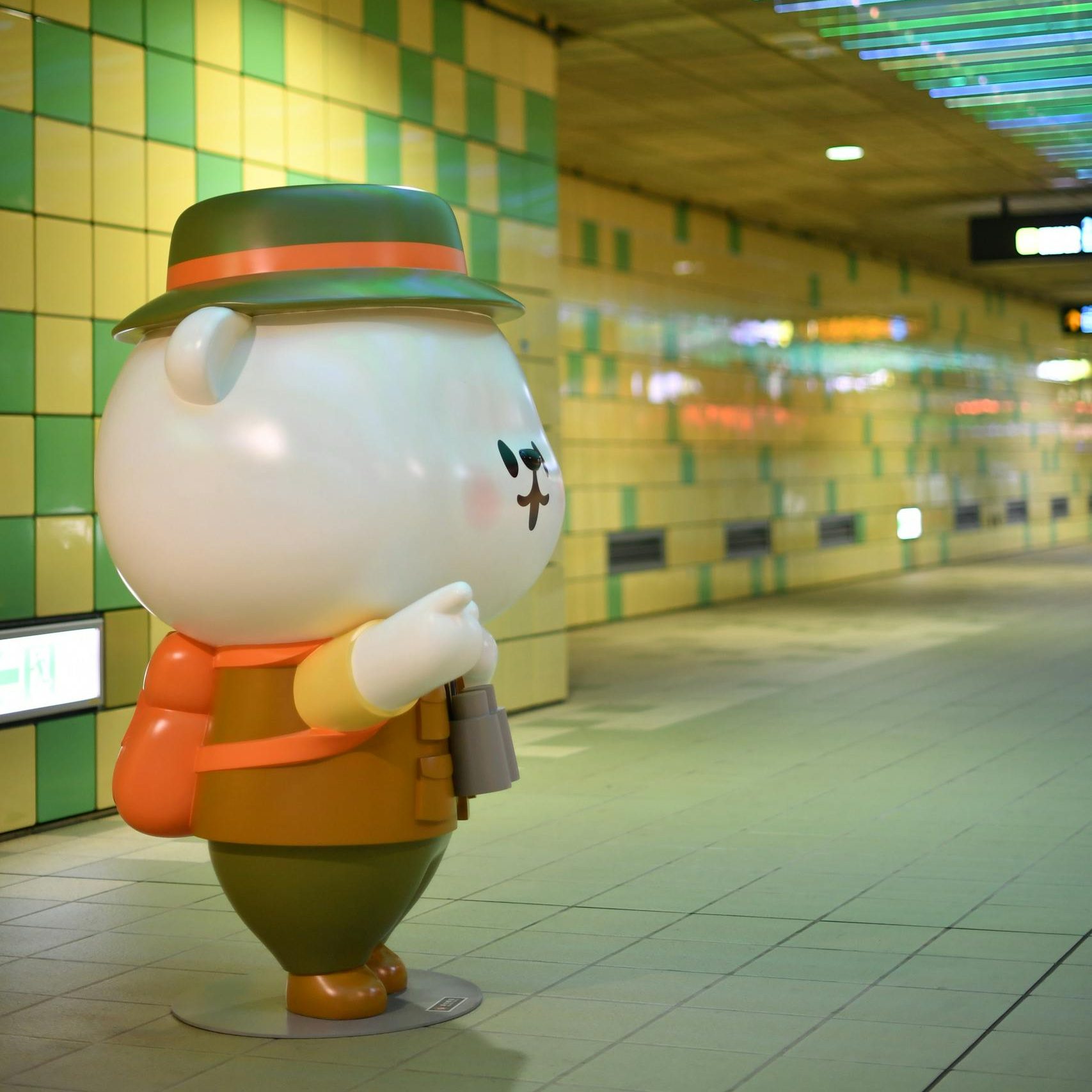 Mondo Mascot on Colorful Subway Platform