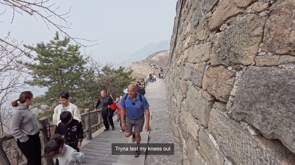 Man walking up Great Wall of China - Taking parents to Great Wall of China