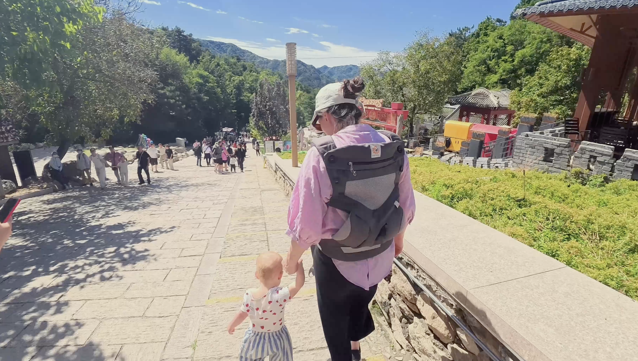 Family with a baby at the Mutianyu Great Wall near Beijing after arriving with a private driver