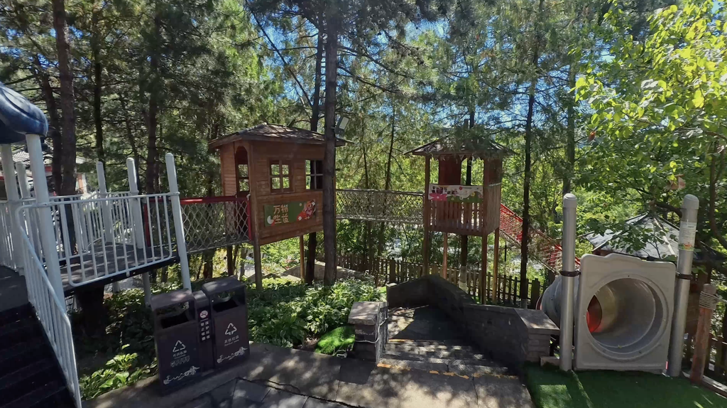 Hidden kids' playground with wooden treehouses near Mutianyu Great Wall